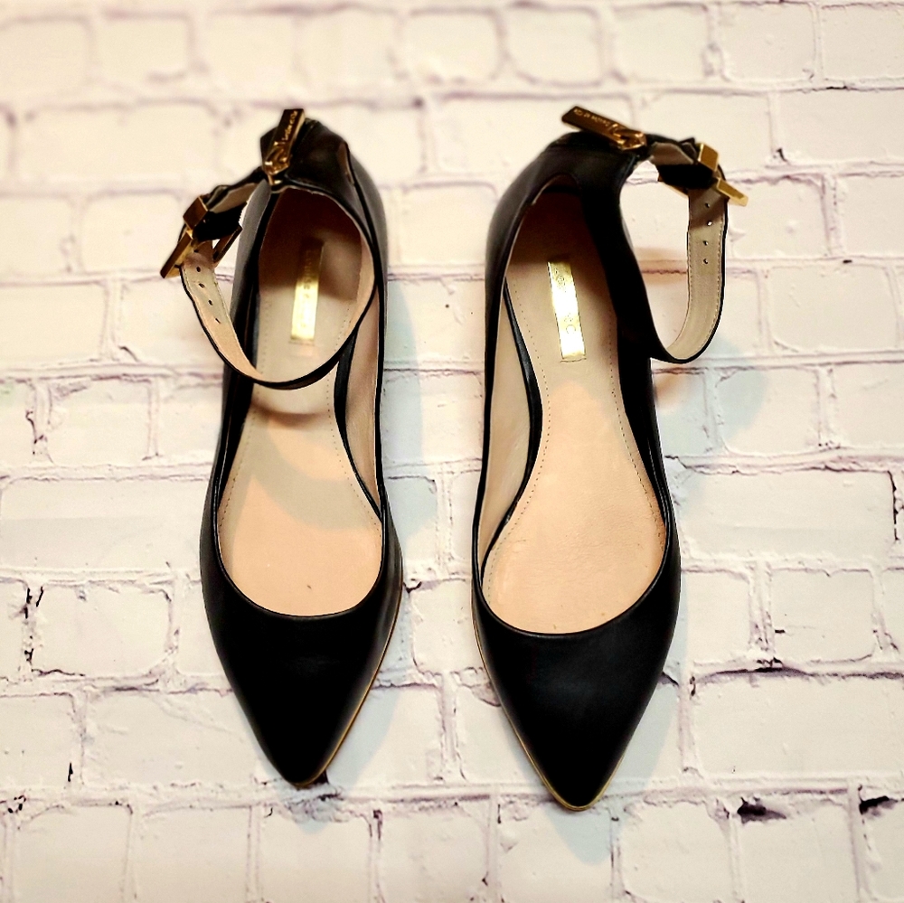 Black Louise Et Cie flats with gold trim ✨